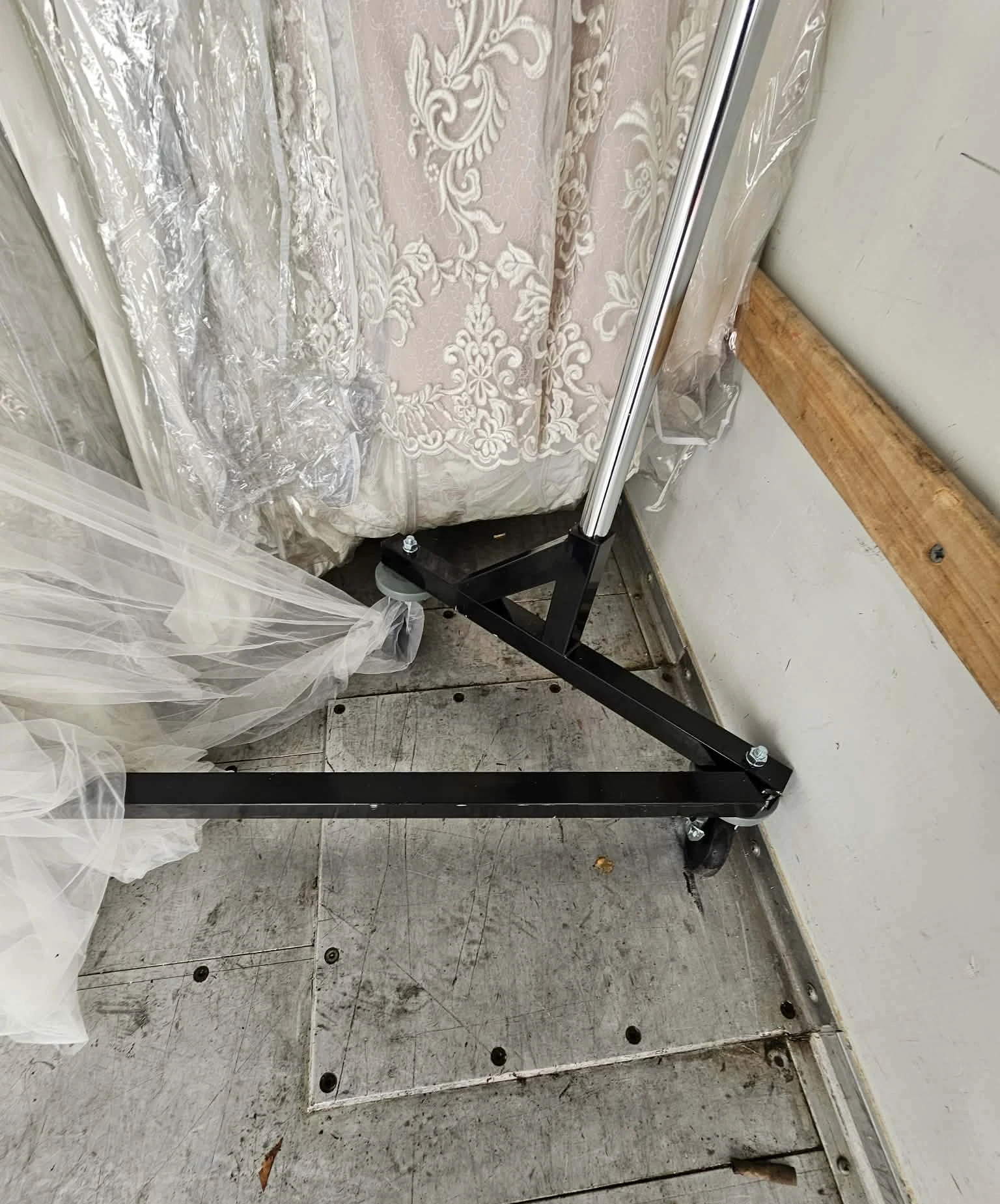 Gown caught on rack base in truck