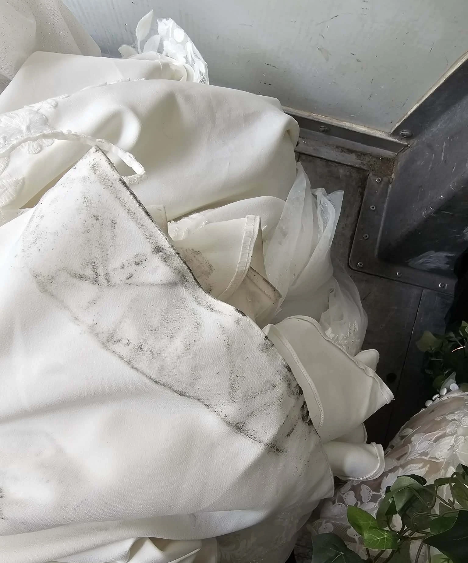 Gown with heavy soiling piled on truck floor