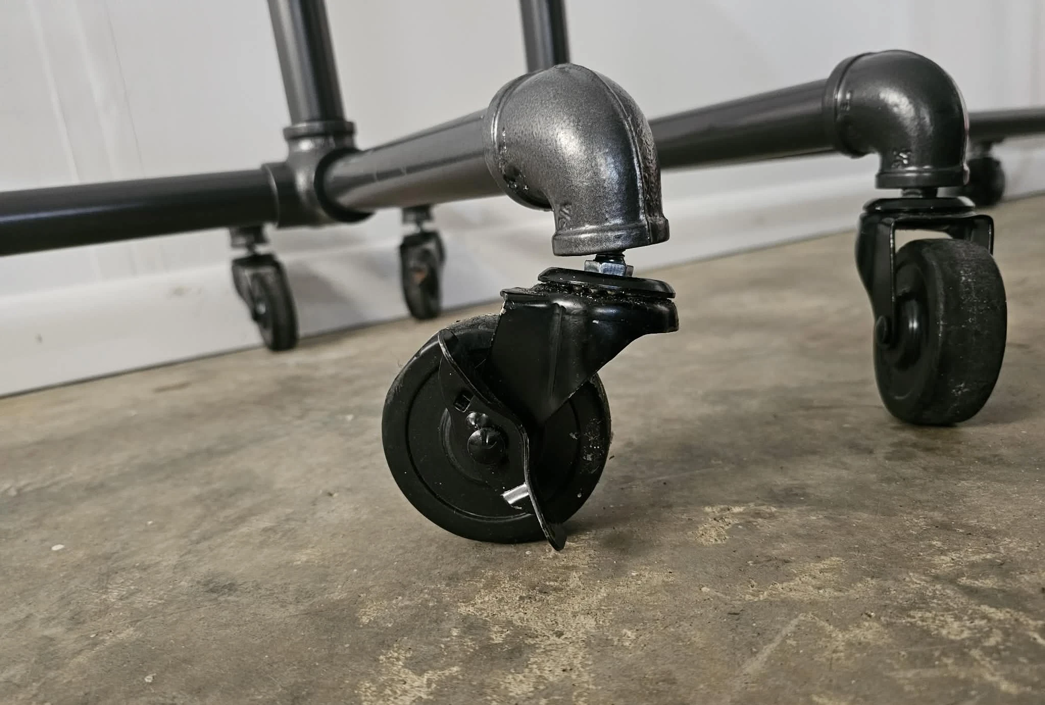 Broken caster wheel on pipe rack