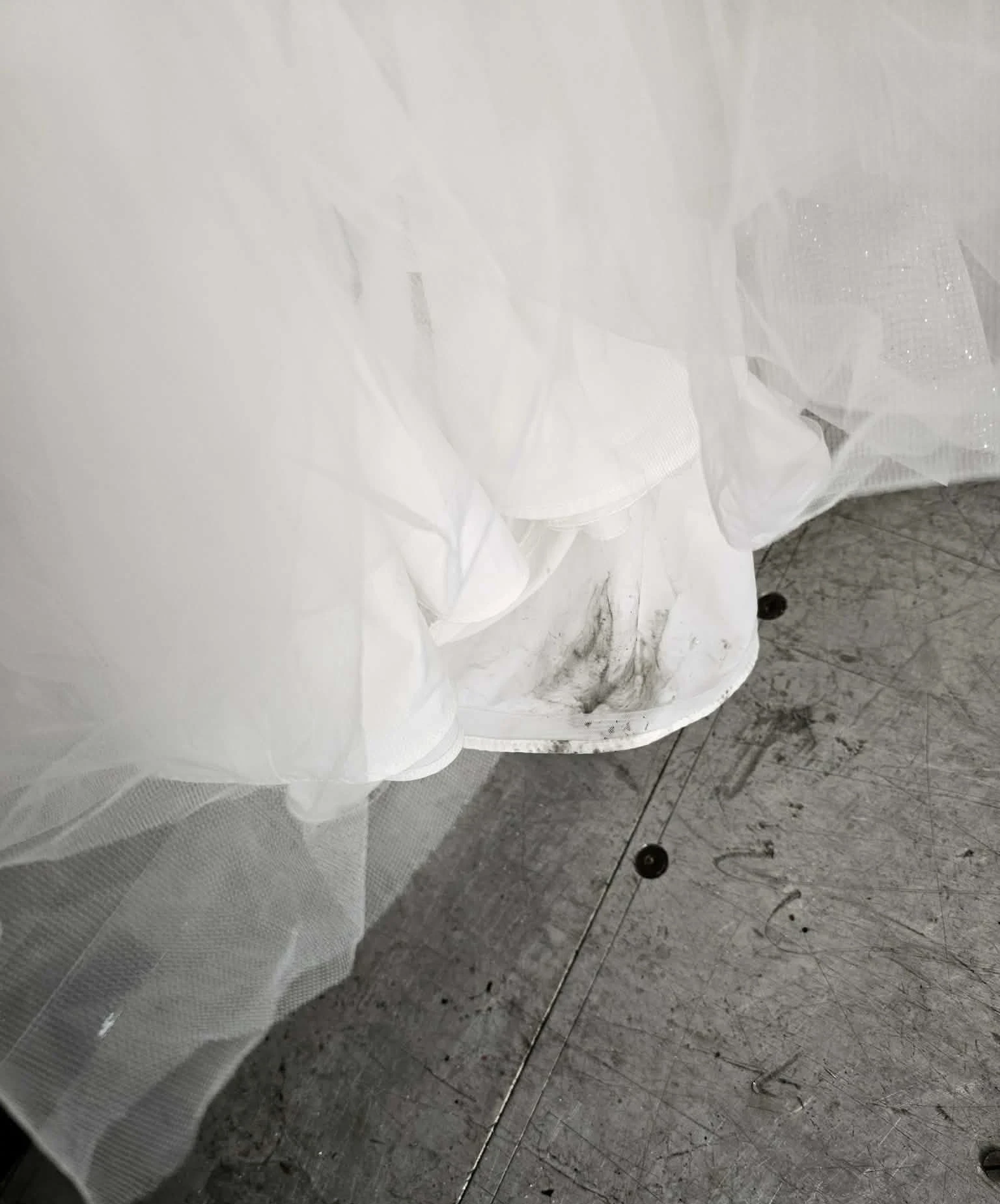 Gown hem with black staining