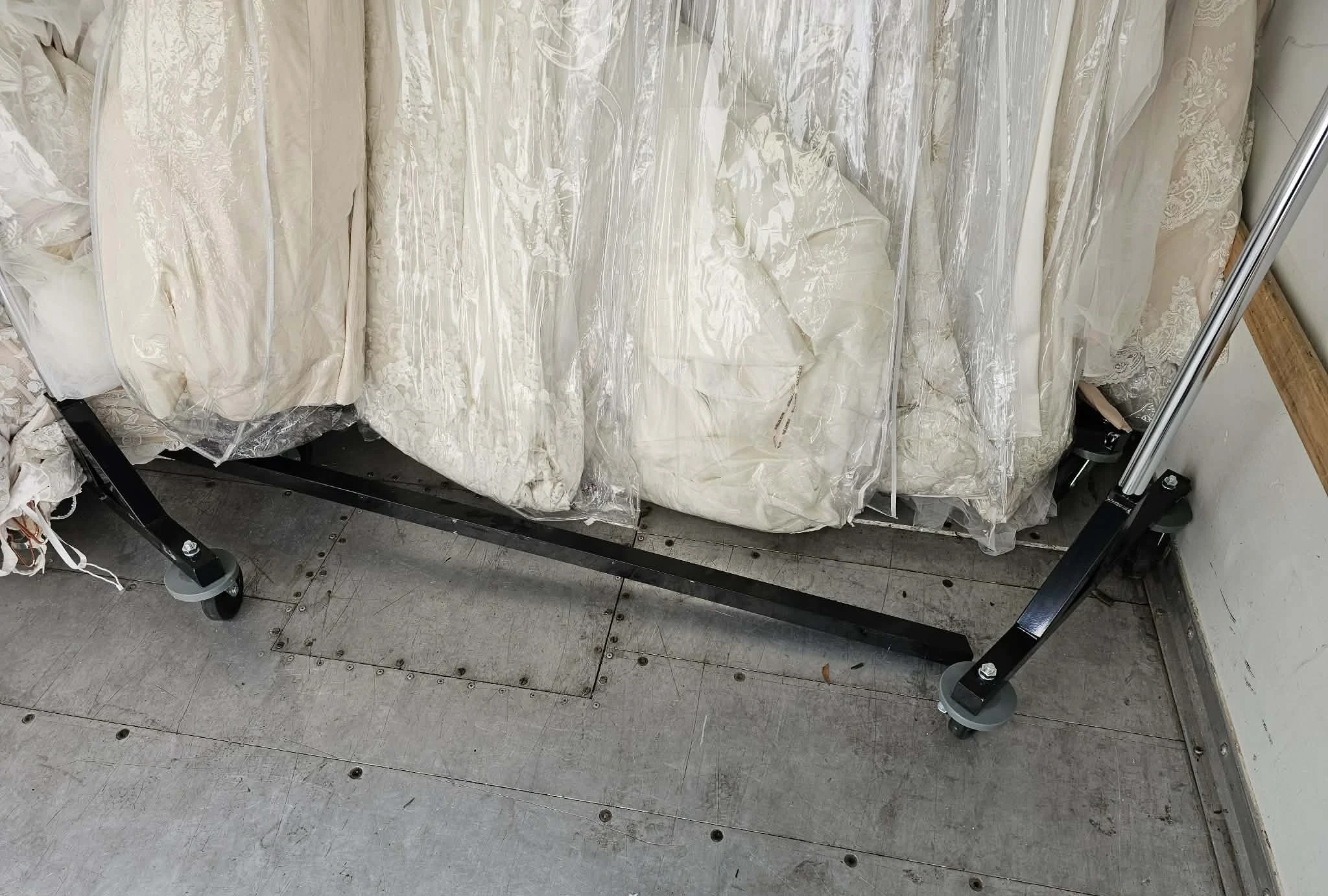 Pipe rack with gowns dragging on floor