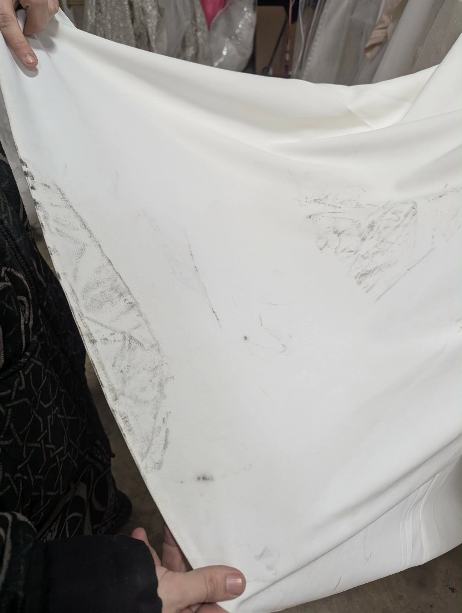 Gown with multiple grease marks displayed